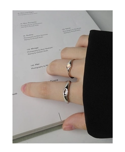 Detail of S925 sterling silver ring set featuring an opal stone and irregular metal band