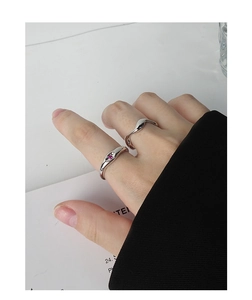 Close-up of S925 silver wave ring and marquise-cut pink zircon ring set on finger