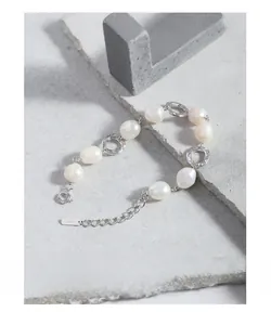 Macro view of S925 sterling silver bracelet with baroque pearls and hollow rings