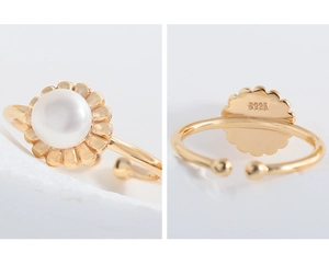 Close-up of S925 sterling silver stamp and elegant pearl floral ring detail