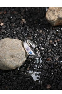 Detailed shot of S925 silver ring featuring purple square and blue star zircon stones