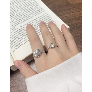 S925 sterling silver conch shell open ring with moonstone gemstone on an open book