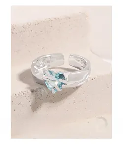 Detailed macro view of S925 silver ring featuring a blue heart-shaped gemstone and texture
