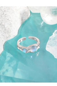 Close-up of S925 silver ring with moonstone and irregular lava texture details