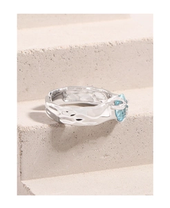 Detail view of S925 silver ring featuring irregular lava texture and blue zircon stone