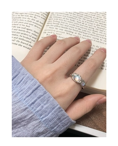 Detailed view of S925 silver ring featuring moonstone and irregular lava texture