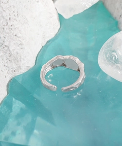 Detailed view of S925 silver ring with irregular hammered texture and adjustable opening