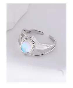 Close-up of S925 silver moonstone ring with organic molten texture and fluid design