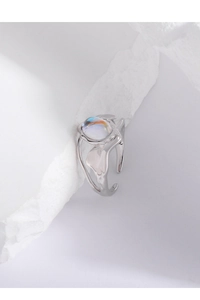 Detail of S925 silver ring featuring moonstone and irregular lava texture on white stone