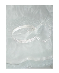 Macro shot of S925 sterling silver open bracelet with hammered bark texture details
