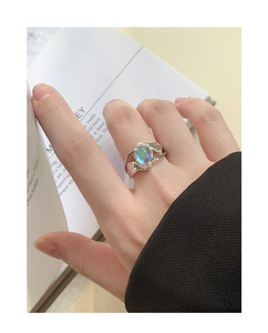 Close-up of S925 sterling silver moonstone ring with irregular texture on a model's finger