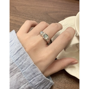 Modern S925 silver moonstone ring with liquid metal texture on female hand
