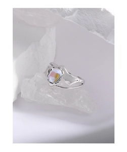 Macro shot of S925 silver ring with moonstone gemstone on white crystal stones