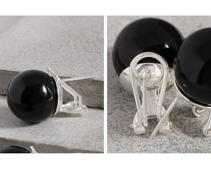 Detailed macro view of S925 sterling silver leverback clasp and black onyx bead earrings