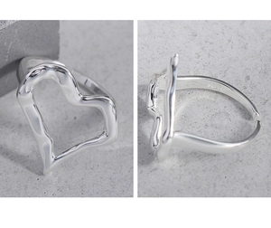 Detailed macro of S925 sterling silver ring featuring irregular heart shape and lava texture