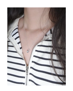 Polished silver heart pendant necklace on S925 sterling silver chain shown on model