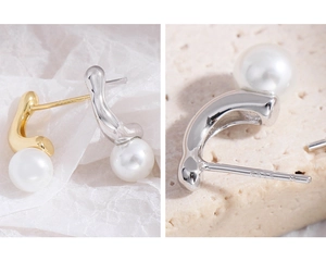Detailed macro shot of S925 sterling silver hallmark on irregular pearl earrings