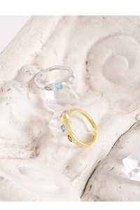 Macro detail of wave-textured S925 silver rings with three-color zircon gemstones