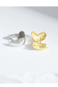 Detailed close-up showing S925 sterling silver hallmark on geometric heart stud earrings