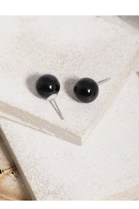 Detail of S925 silver stamp on minimalist black onyx round ball stud earrings