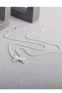 Close-up of a 925 silver beaded necklace with a minimalist polished bow pendant