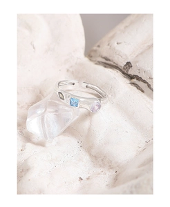 Macro detail of S925 silver ring with colorful cubic zirconia on crystal cluster