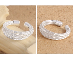 Macro detail of S925 sterling silver multilayer wire ring with textured finish