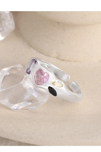 Close-up of S925 silver open ring with colorful zircon stones on crystal prop