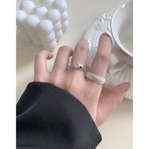 S925 sterling silver layered rings with colorful heart gemstones worn on model hand