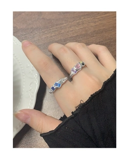 Detailed close-up of s925 silver wave rings with pink heart and blue zircon stones