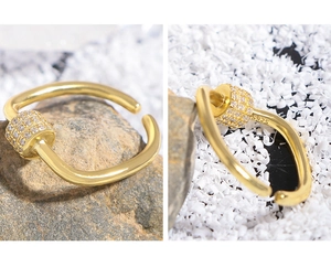 Macro detail showing S925 hallmark on gold plated U-shape ring with zircon accents
