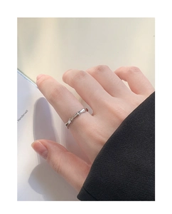 Detailed view of S925 sterling silver bamboo joint ring on model hand with a polished finish