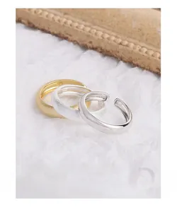 Macro shot of S925 sterling silver minimalist rings featuring matte and polished finishes