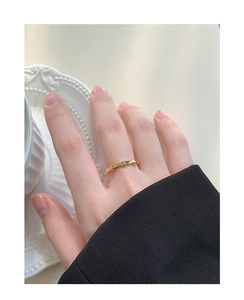 Close-up of a polished golden bamboo-style S925 silver ring worn on a finger