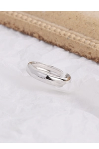 Macro shot of S925 sterling silver stamp on minimalist polished inner band of the ring