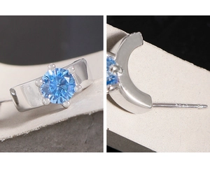 Vista dettagliata degli orecchini in argento sterling S925 con zircone blu e sei griffe