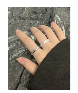 Detail of S925 silver rings showing one polished surface and one frosted sandblasted texture