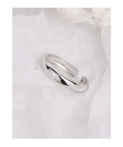 Detailed macro view of S925 hallmark on a minimalist polished silver open ring