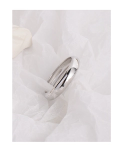 Macro shot of minimalist S925 sterling silver ring showing the inner hallmarked stamp