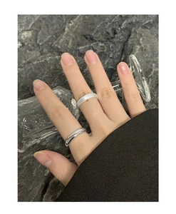 Detail of s925 silver rings showing contrasting matte and polished mirror finishes