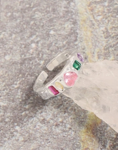 Detailed macro view of S925 silver ring with hammered texture and colorful zircon stones
