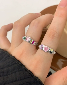 Close-up of S925 silver rings with colorful heart and geometric zircon stones