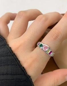 Detail of silver S925 ring featuring colorful heart-shaped and geometric zircons