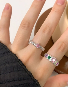 Macro shot of S925 silver rings with colorful zircon inlays and wrinkled texture details