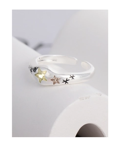 Macro shot of S925 silver wide open ring featuring colorful inlaid zircon star patterns