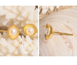 Close-up of S925 silver shell pearl earrings with golden scallop texture details