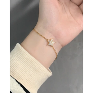 Minimalist gold S925 sterling silver star pendant bracelet with zircon on wrist