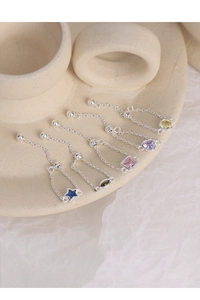 Detail of five adjustable S925 silver chain rings with colorful geometric zircon stones
