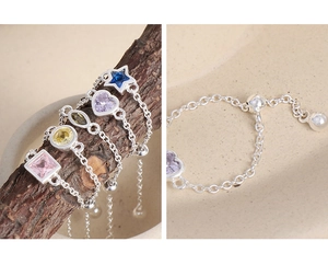 Detail of adjustable S925 sterling silver chain ring with colorful zircon stone settings