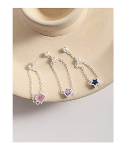 Detailed shot of S925 silver adjustable chain rings with pink, purple, and blue cubic zirconia